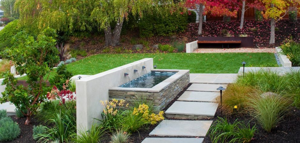 Modern water Fountain in backyard walkway. Installation by Seattle Pond and Fountain. Experts in their field.